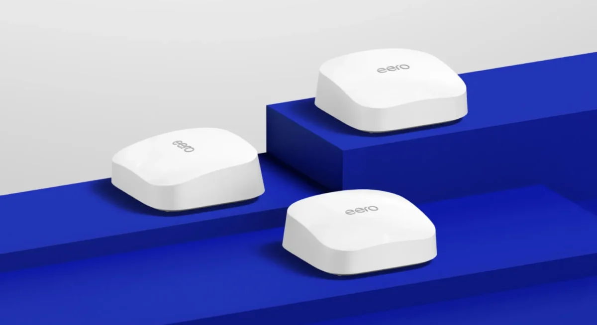 Three Eero Pro 6e's sitting on blue steps.