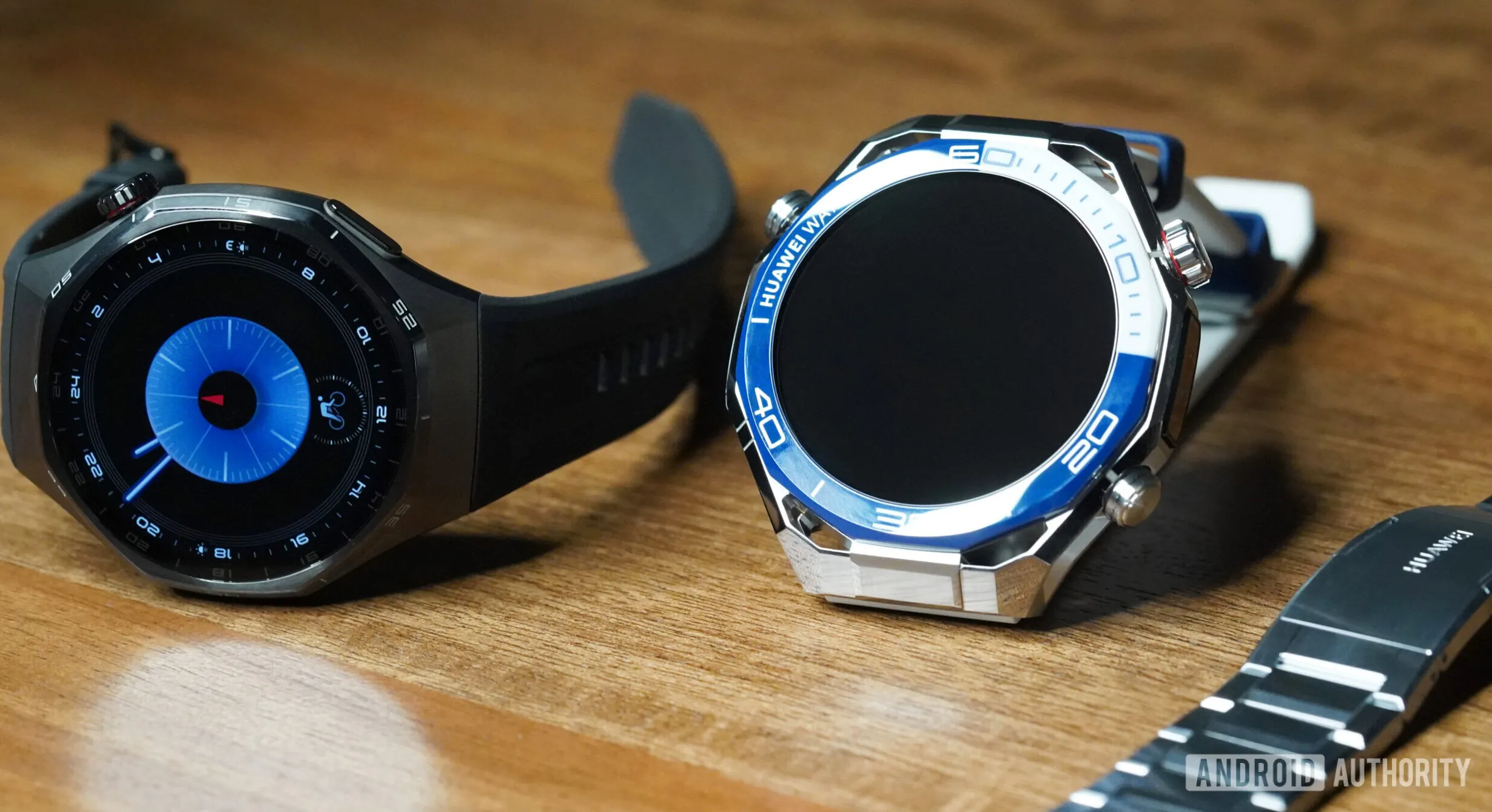 A Huawei Watch GT 6 Pro rests next to a Huawei Watch Ultimate 2.