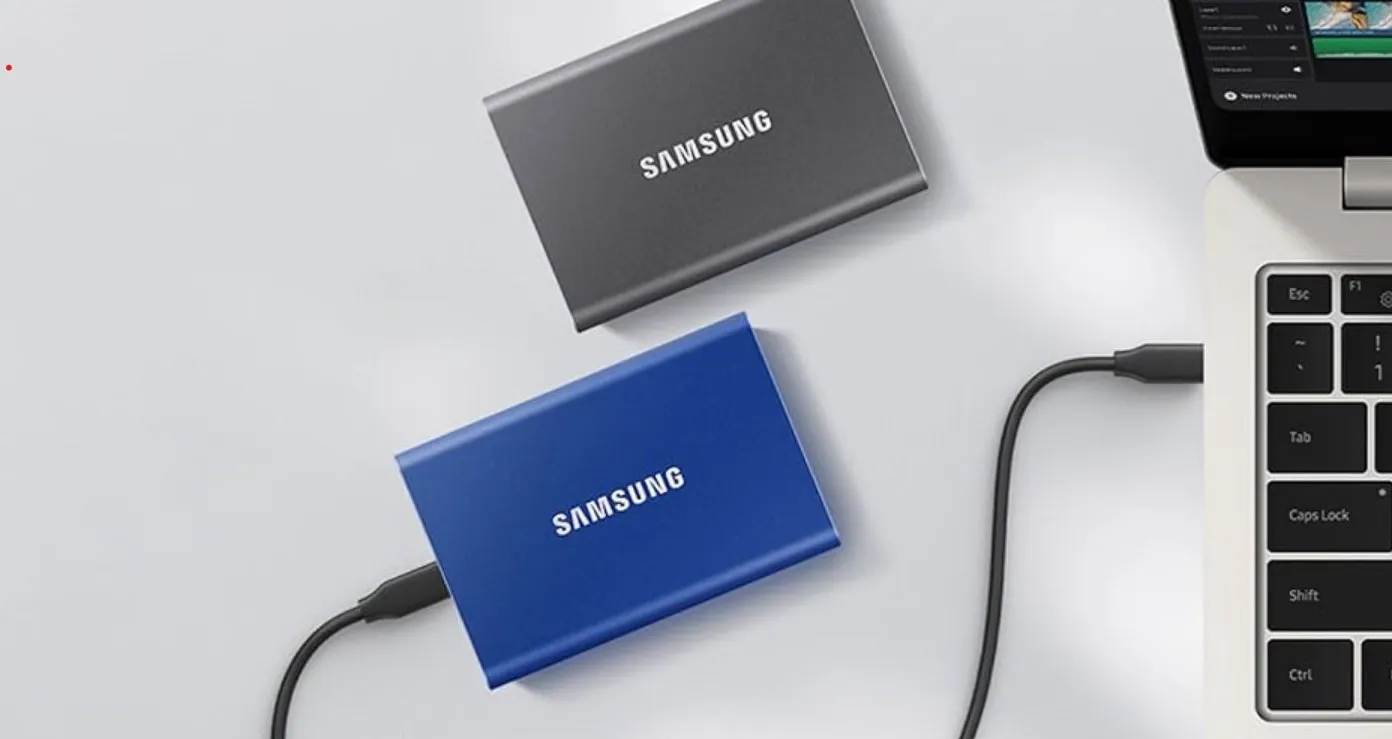 Samsung T7 SSDs next to laptop