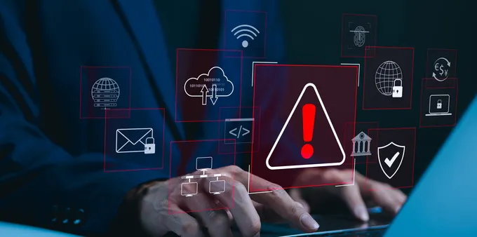 laptop with cybersecurity warnings