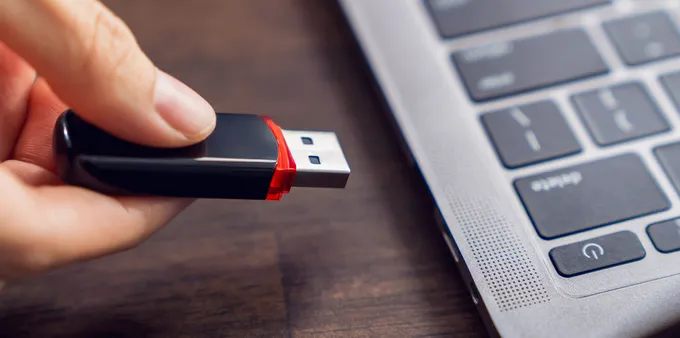 USB drive going into a laptop