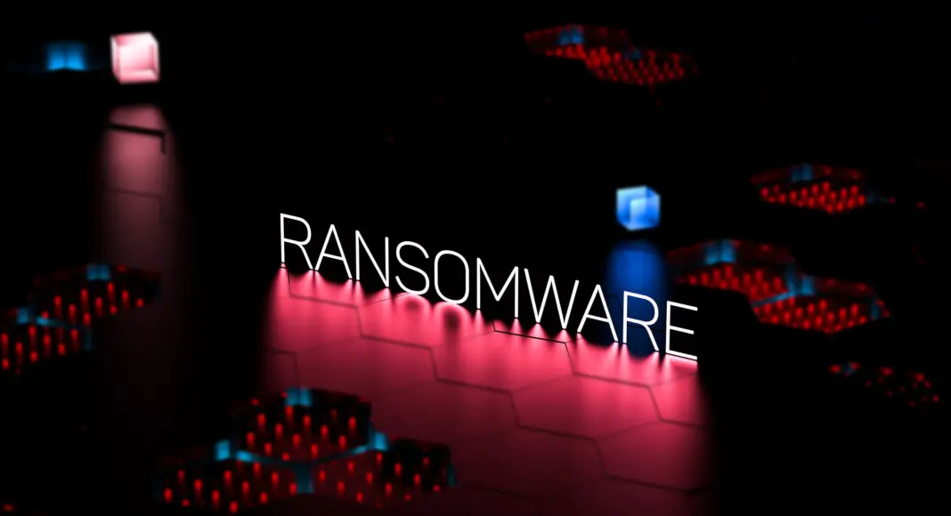Tulisan RANSOMWARE neon dengan latar belakang gelap dan sirkuit berwarna merah biru