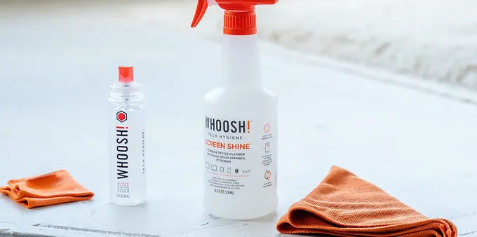 Two bottles of Whoosh! screen cleaner with two microfiber cloths.