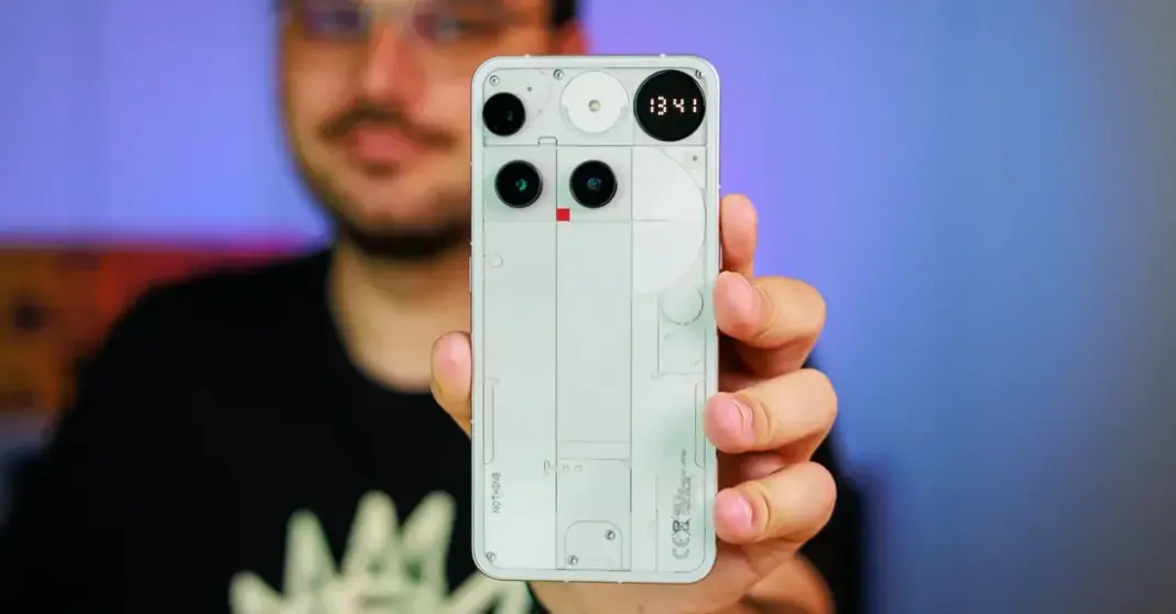 Ilustrasi ponsel Nothing dengan tampilan interface AirDrop yang sedang mentransfer file ke perangkat iPhone